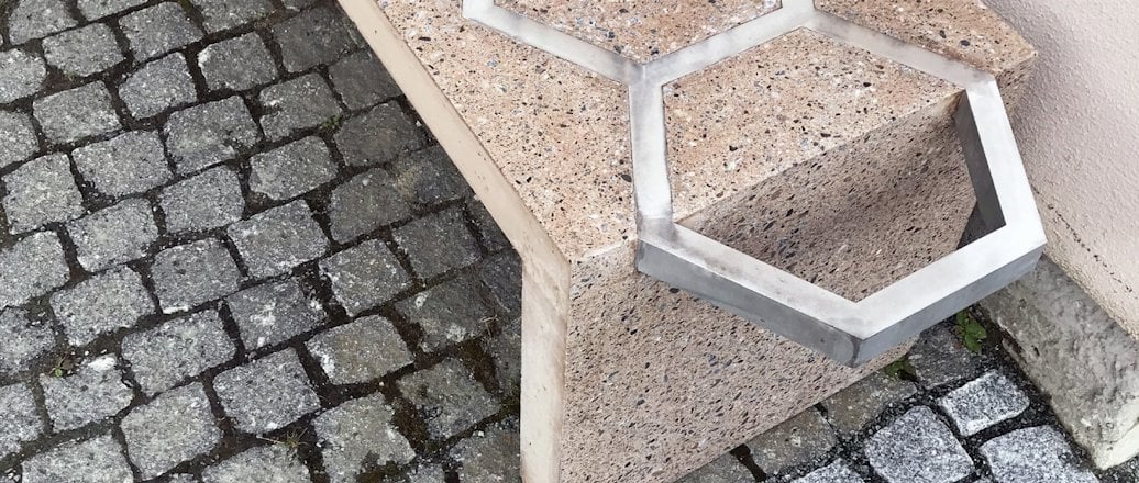 a bench on a stone path