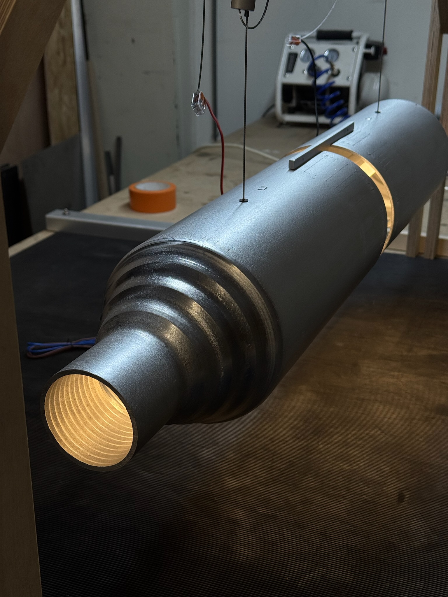 a metal cylinder on a table